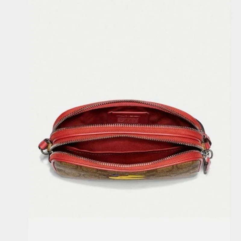 Crossbody Pouch in Signature Canvas with Ms. PacMan