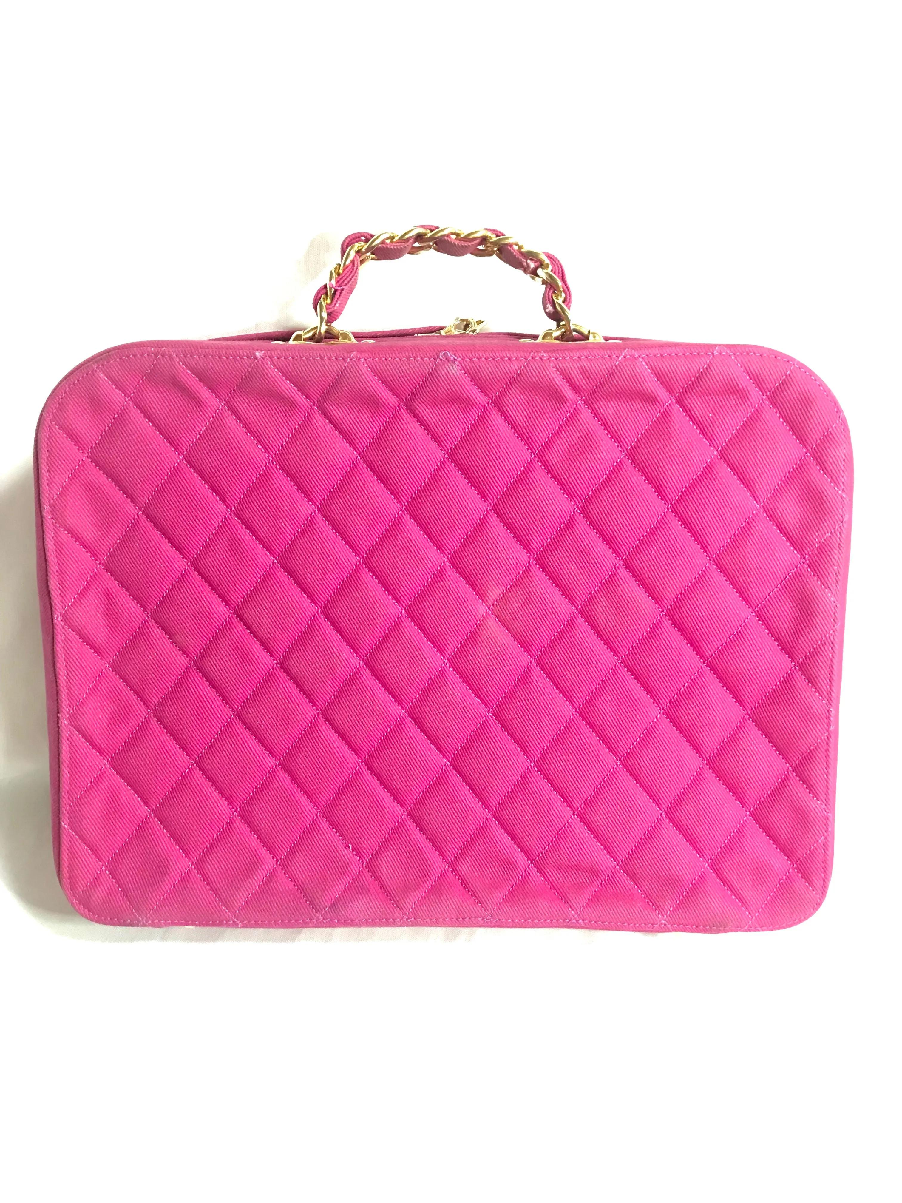 Vintage CHANEL pink canvas business bag style handbag with golden chain handle and a logo charm. Rare and collectible piece.