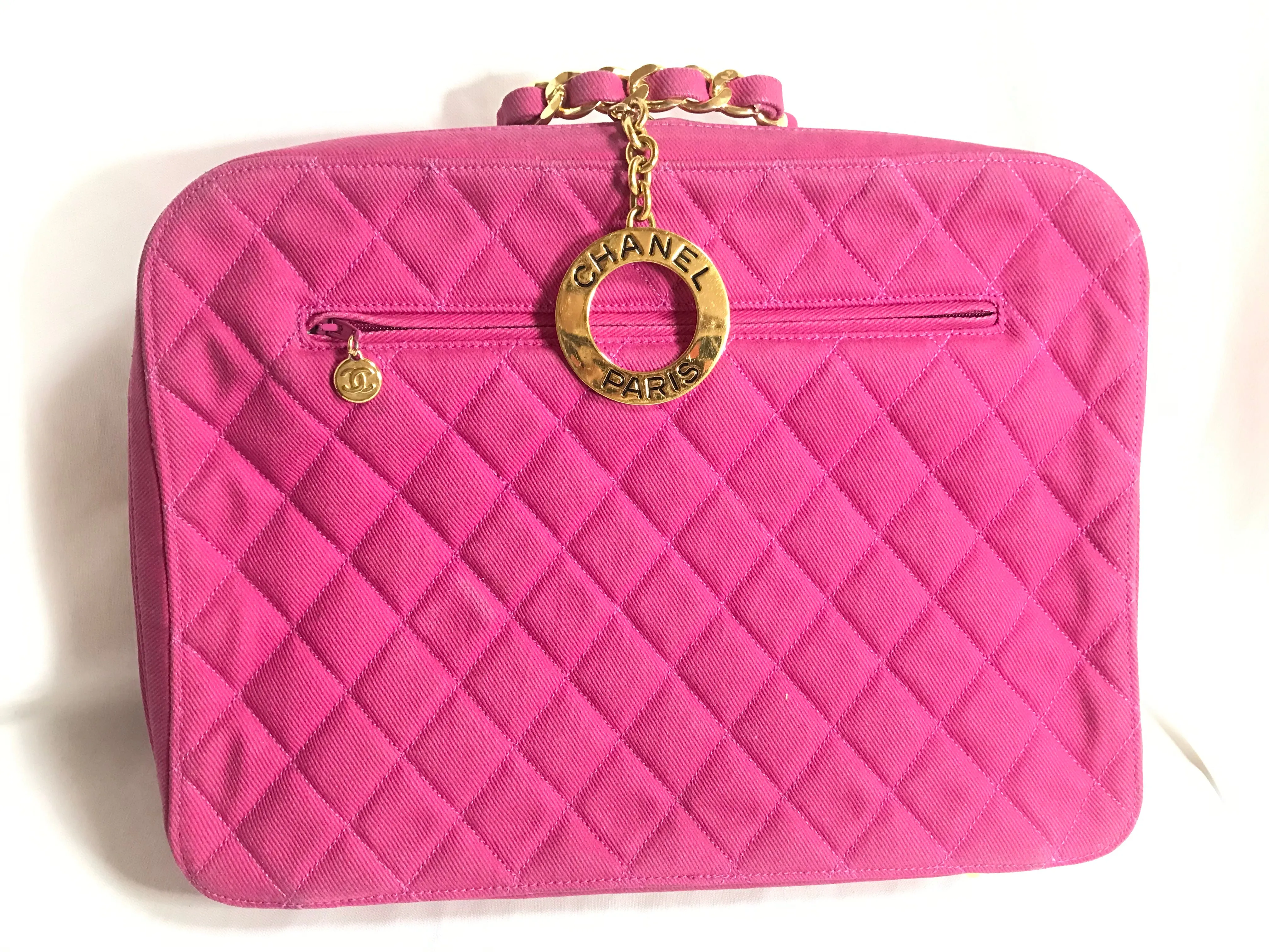 Vintage CHANEL pink canvas business bag style handbag with golden chain handle and a logo charm. Rare and collectible piece.