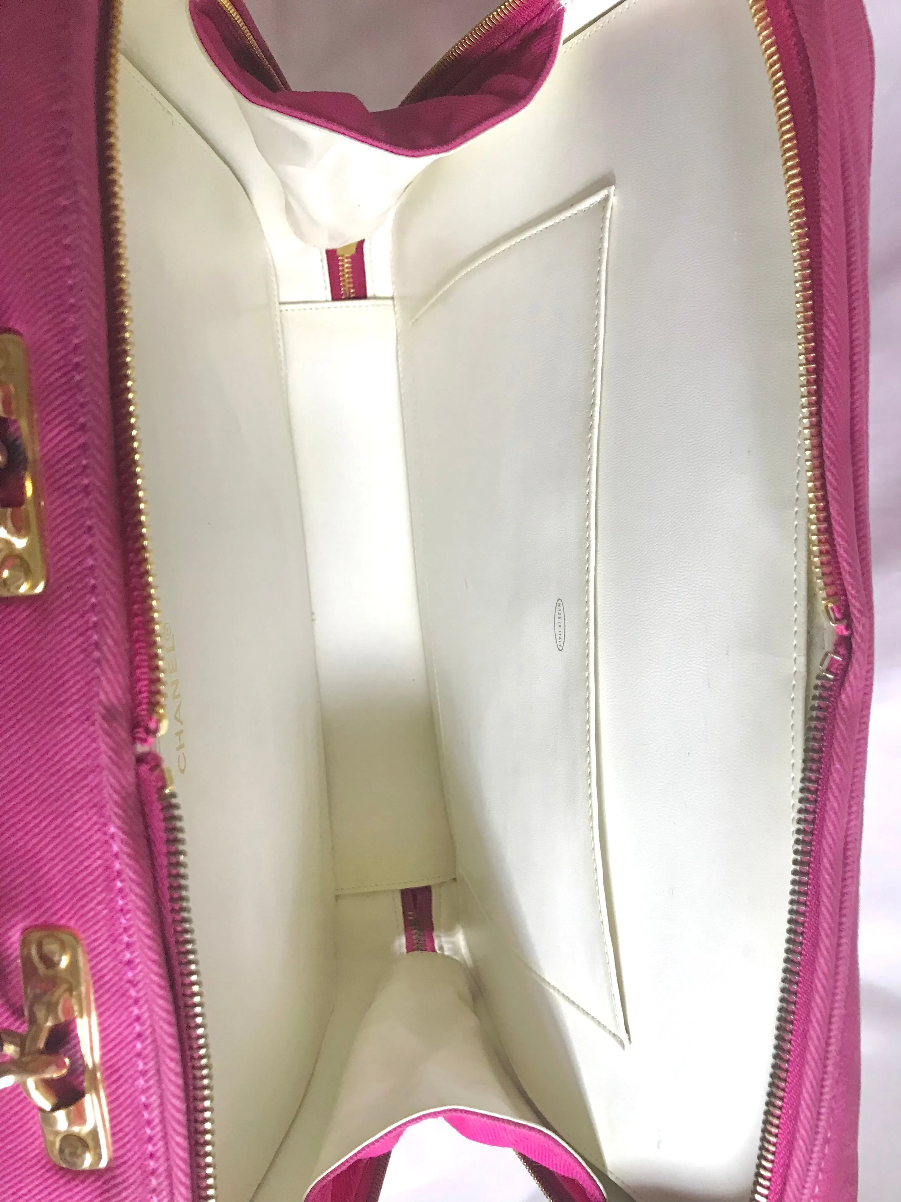 Vintage CHANEL pink canvas business bag style handbag with golden chain handle and a logo charm. Rare and collectible piece.