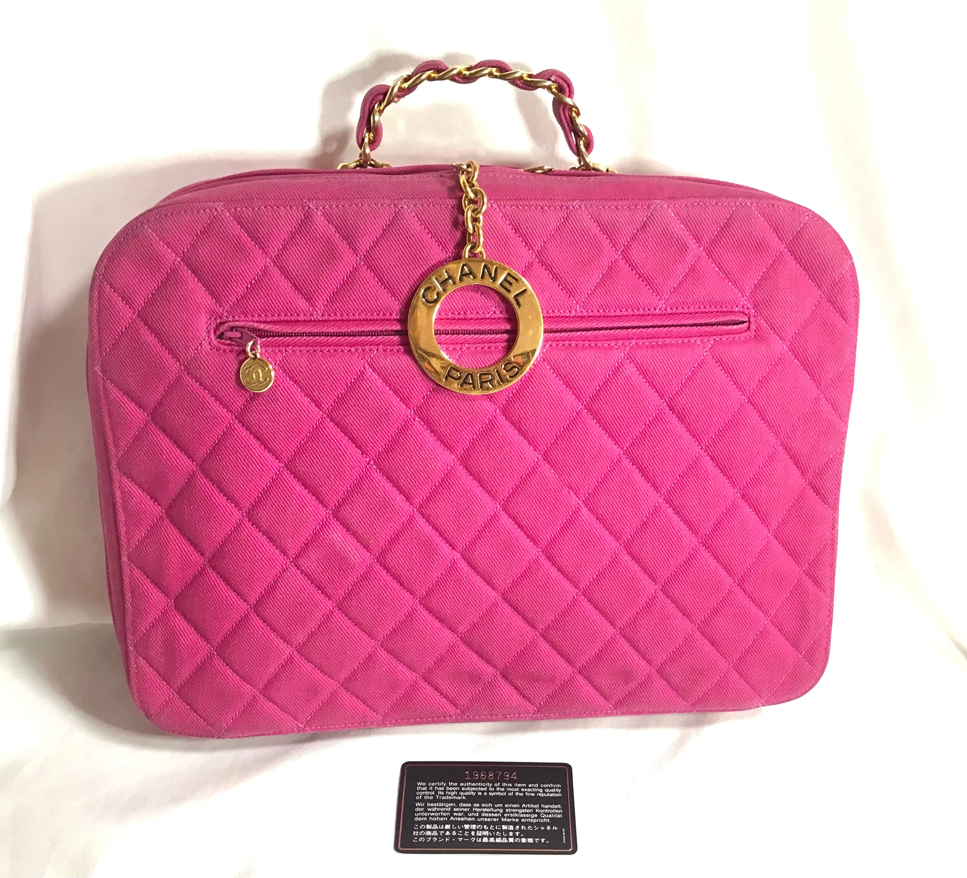 Vintage CHANEL pink canvas business bag style handbag with golden chain handle and a logo charm. Rare and collectible piece.