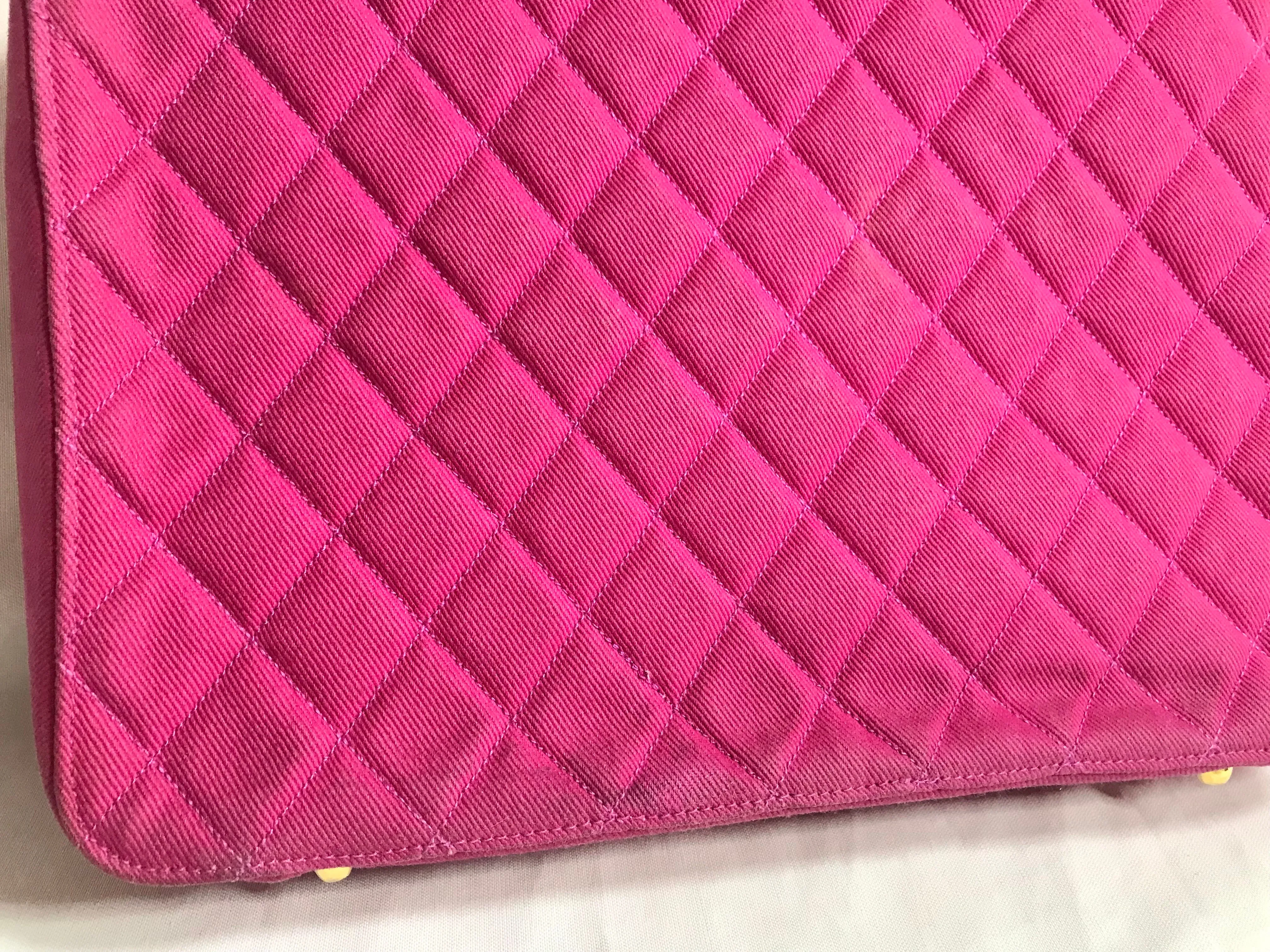 Vintage CHANEL pink canvas business bag style handbag with golden chain handle and a logo charm. Rare and collectible piece.