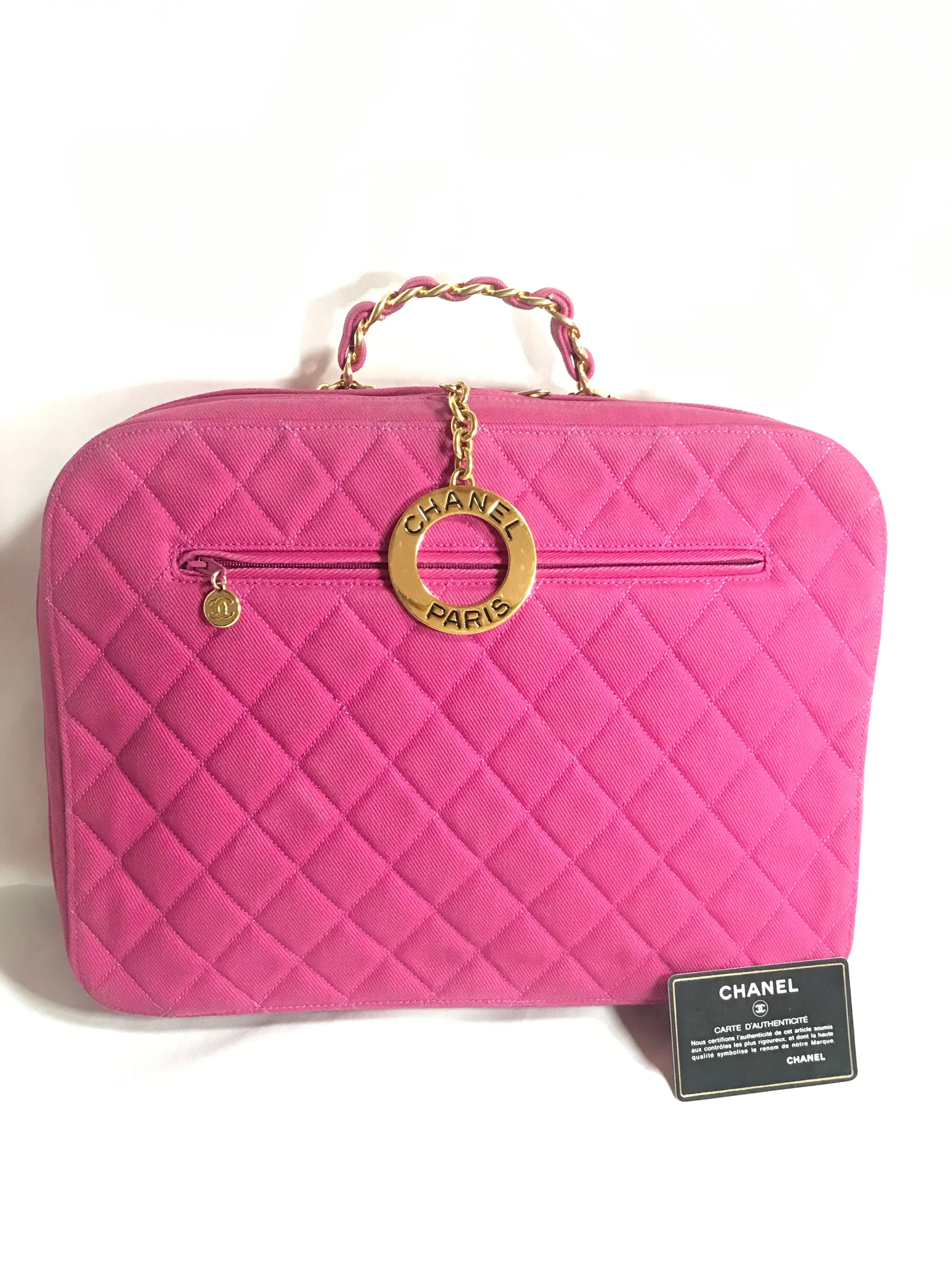 Vintage CHANEL pink canvas business bag style handbag with golden chain handle and a logo charm. Rare and collectible piece.