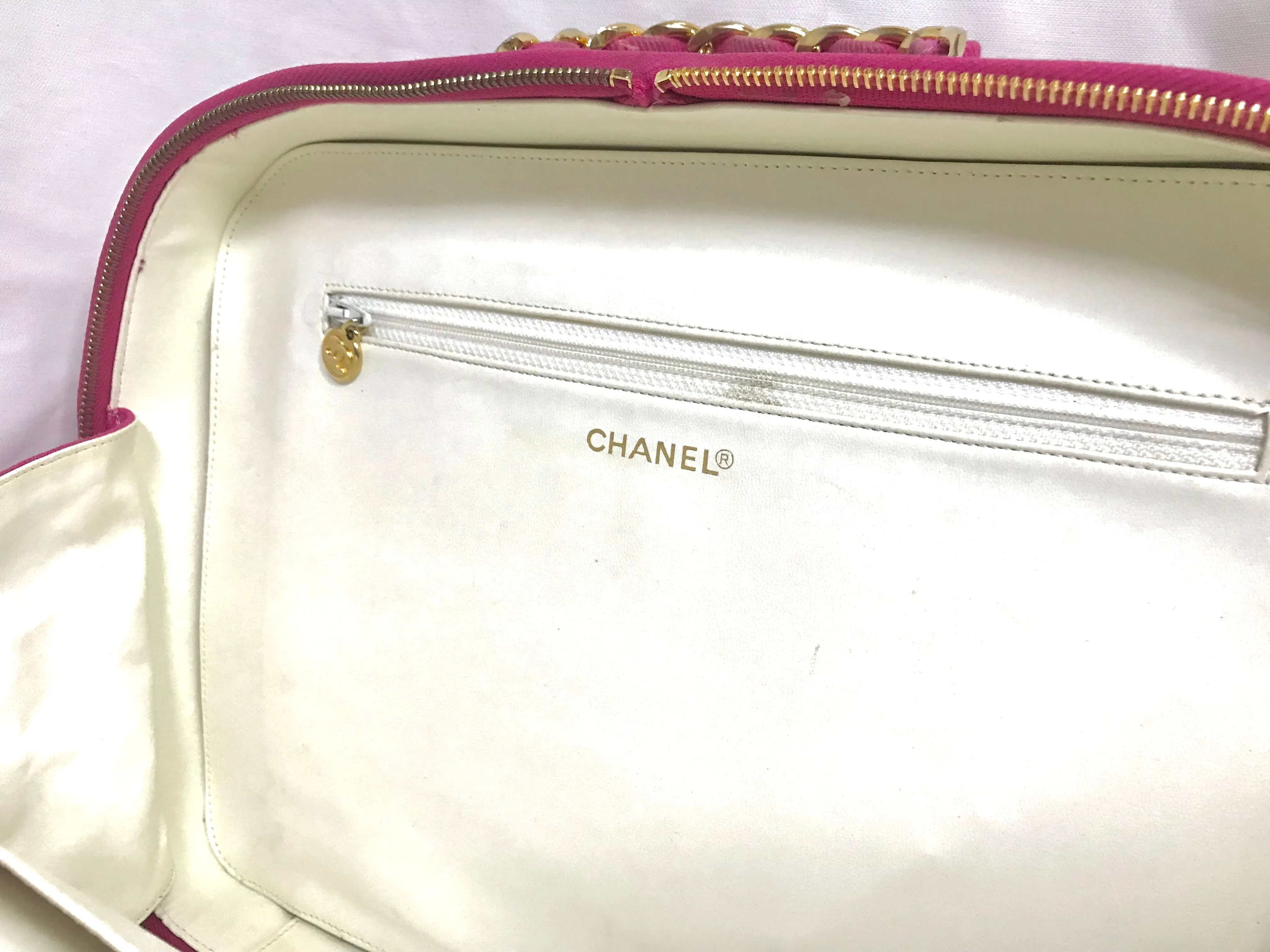 Vintage CHANEL pink canvas business bag style handbag with golden chain handle and a logo charm. Rare and collectible piece.