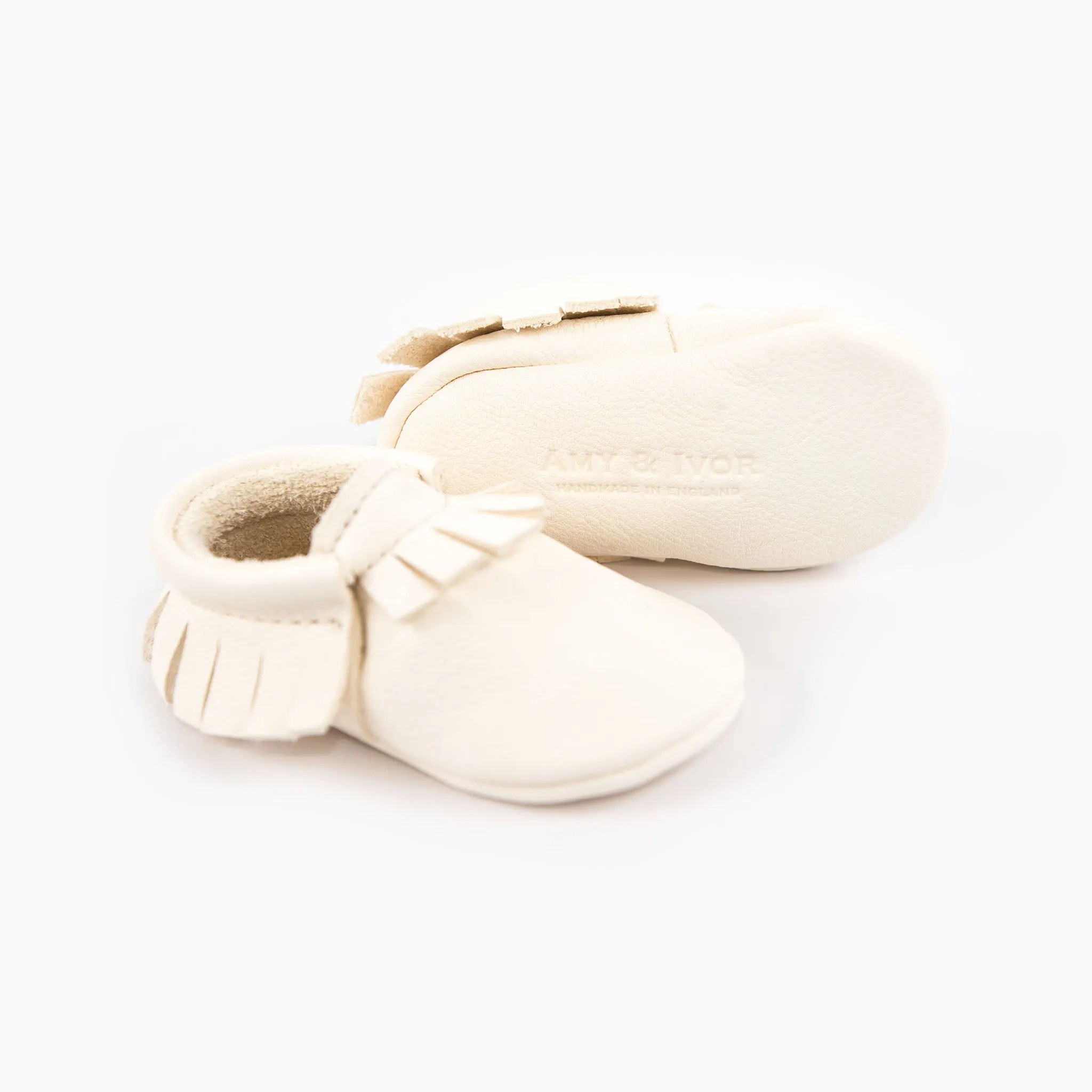 WHITE MOCCASINS